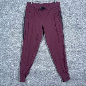 Athleta Womens Medium Burgundy Black Side Stripe Metro Track Jogger Pant Pull On